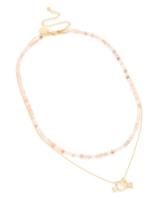 layered necklace: a pink rose quartz bead strand and a fine gold chain with a star pendant